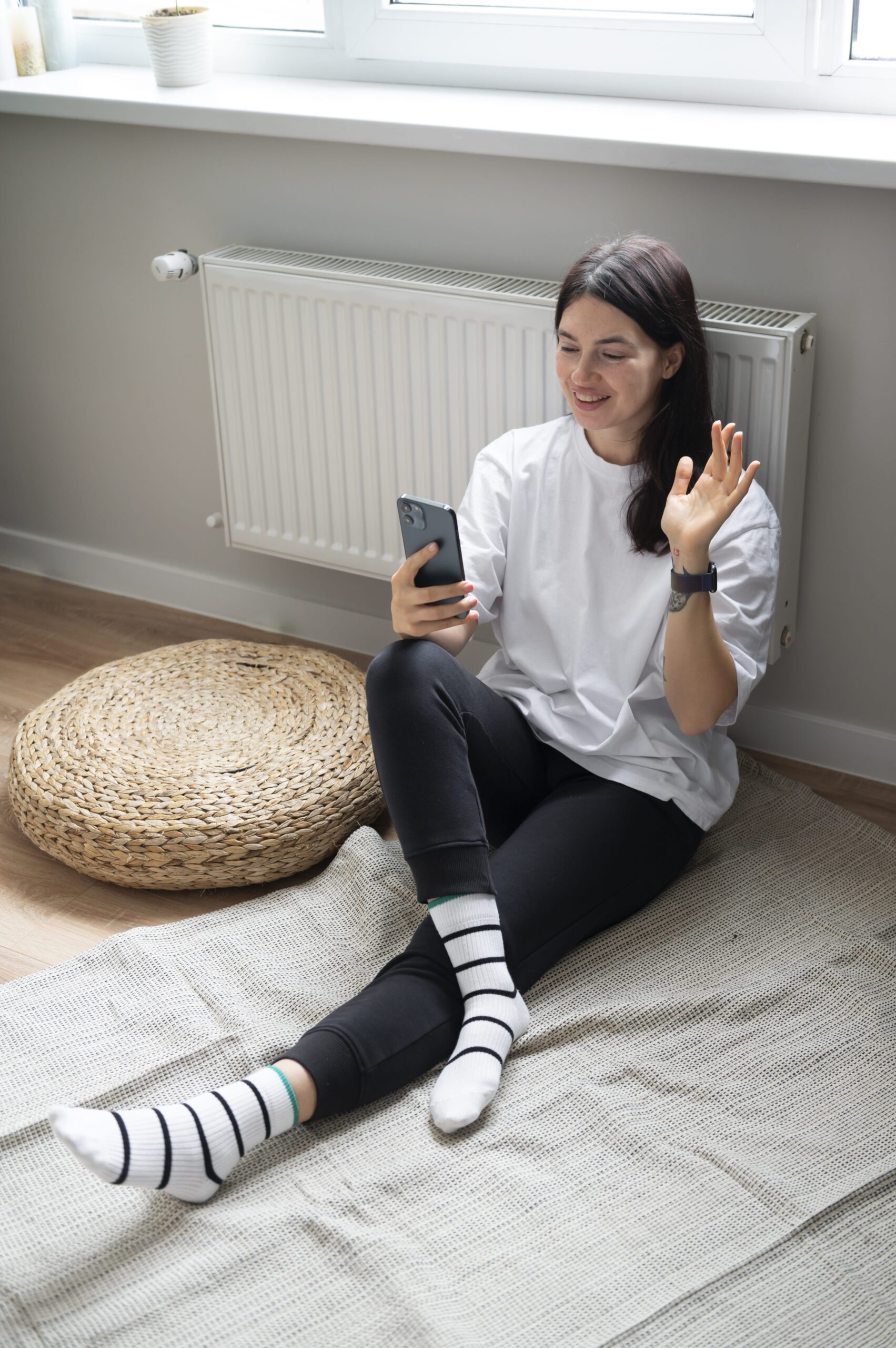 woman-talking-her-smartphone-home-quarantine-min